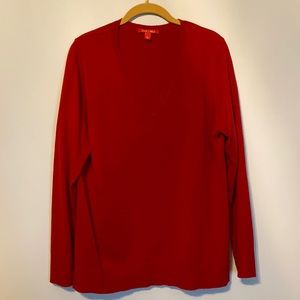 V-Neck, hard to see in picture.  Long Sleeved 100% Acrylic.